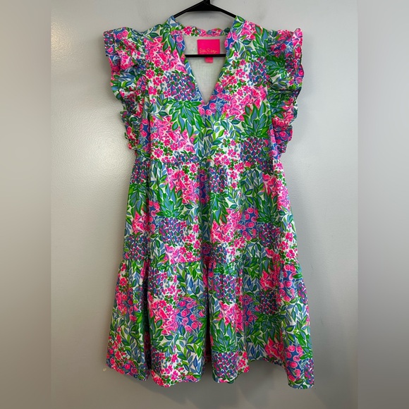 aldena ruffle sleeve cotton dress Lilly Pulitzer ALDENA RUFFLE SLEEVE DRESS Swing fit, tiered dress with a  notch neckline, short, double layer ruffle sleeves, and side seam pockets.  Material: Cotton Poplin (100% Cotton)